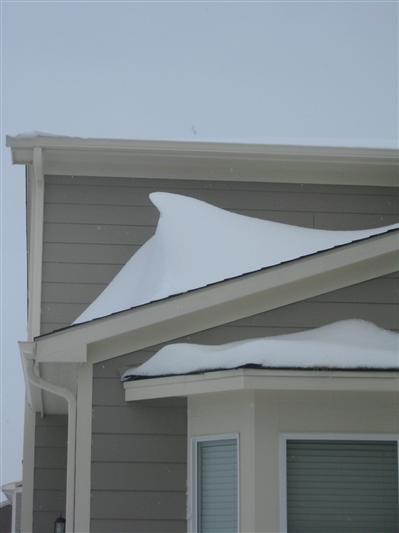 'Snow drifts' op het huis van de buren